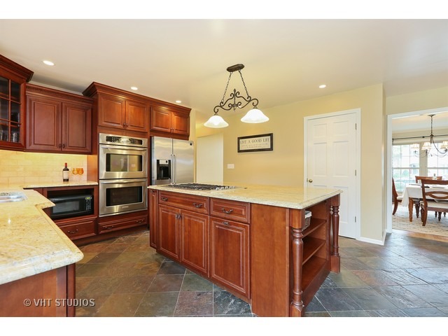 2481 Rio Grande Circle Naperville, IL 60565 - Photo 6 of 25 a kitchen with stainless steel appliances granite countertop a stove a sink and a refrigerator