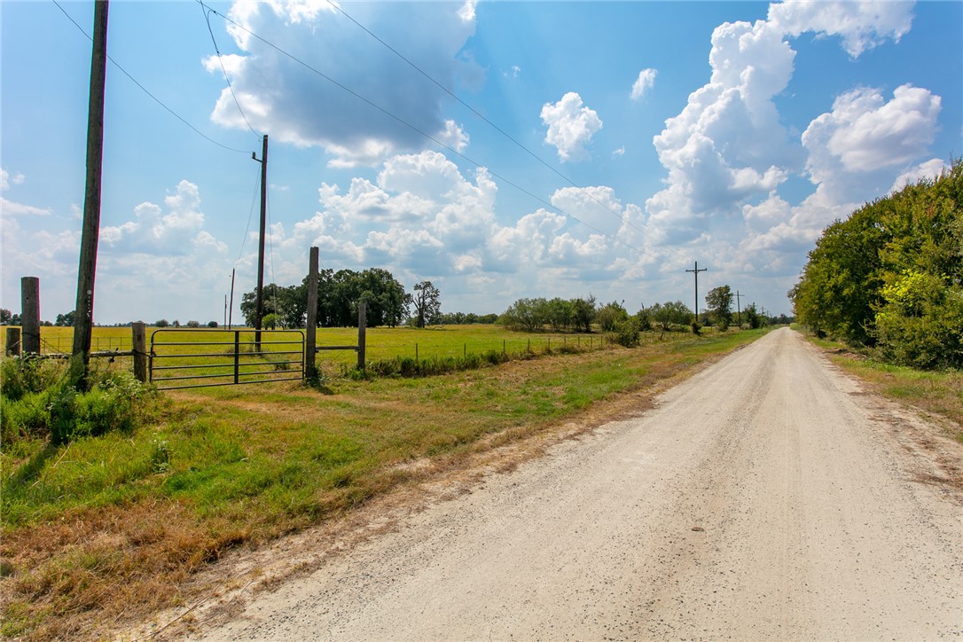 11733 Winstead Lane Calvert, TX 77837 - Photo 2 of 26 View of dirt / gravel road featuring a view of rural / pastoral area