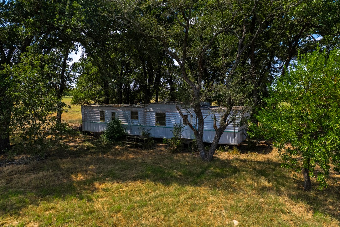 11733 Winstead Lane Calvert, TX 77837 - Photo 23 of 26 View of front of property featuring view of scattered trees and a front yard