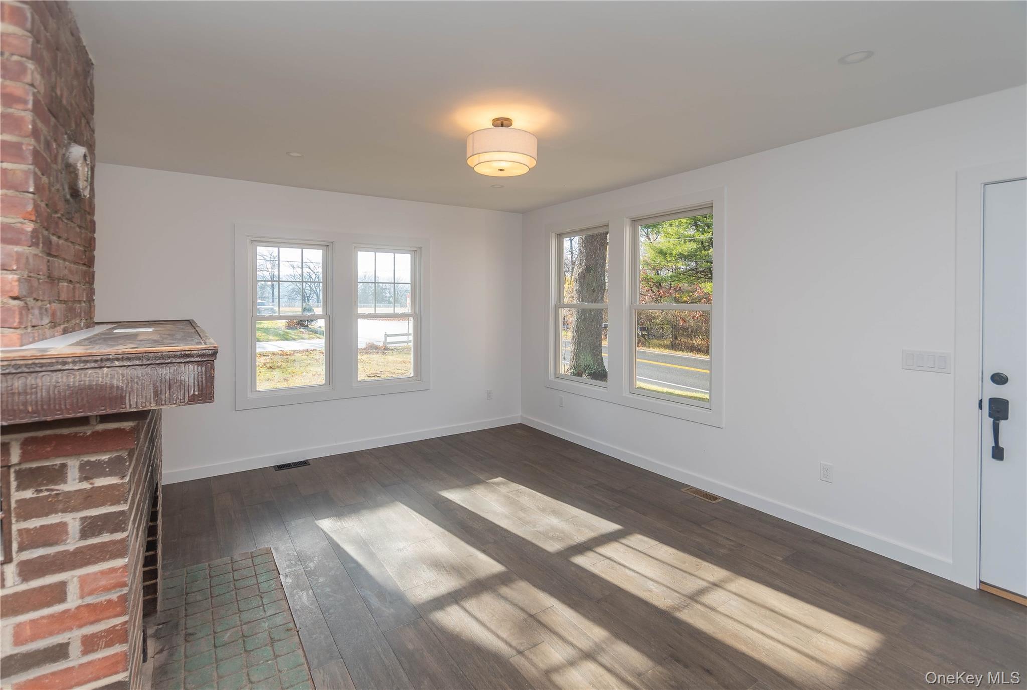 3 Anna Street Kerhonkson, NY 12446 - Photo 11 of 40 Unfurnished living room with dark wood floors