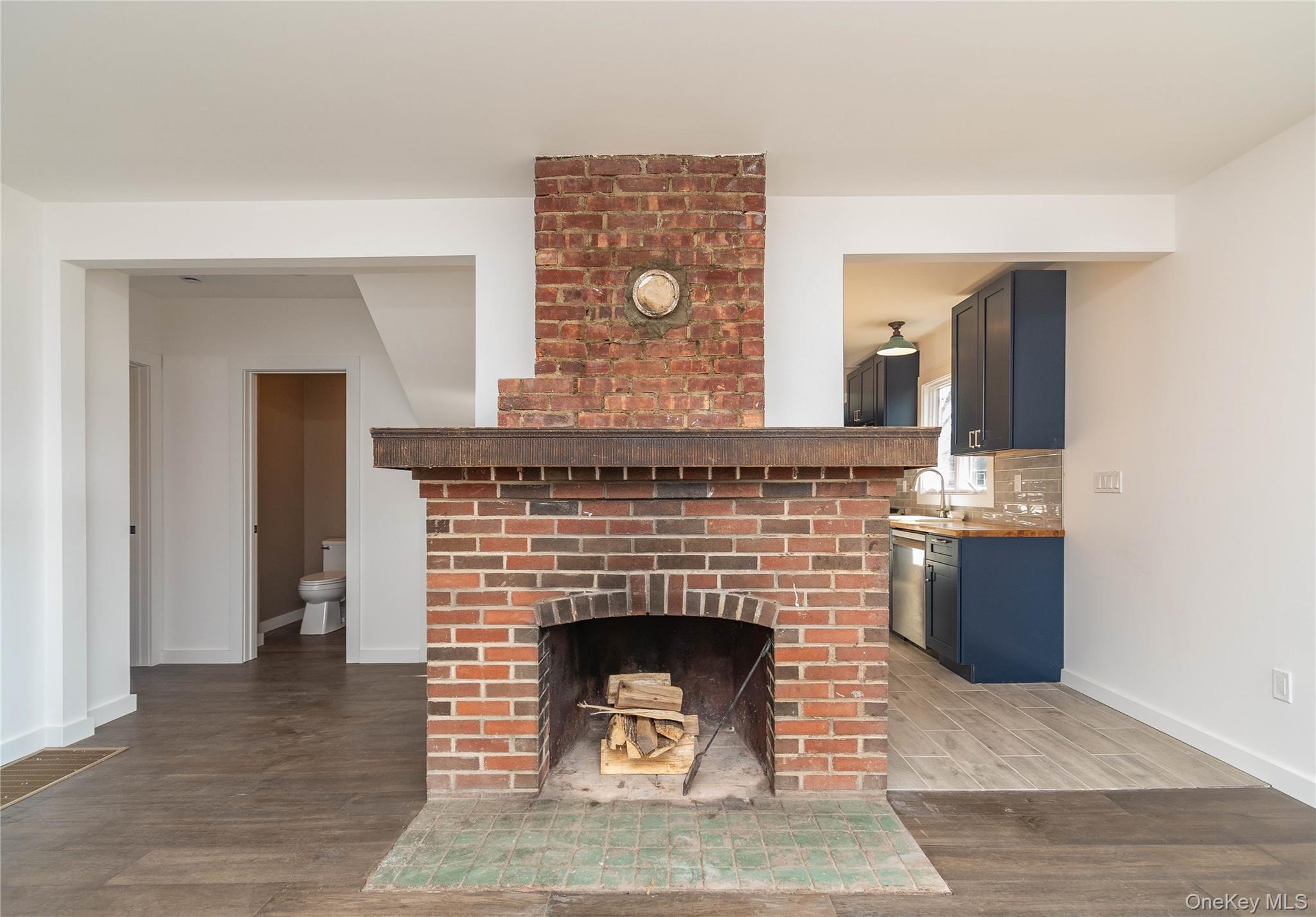 3 Anna Street Kerhonkson, NY 12446 - Photo 12 of 40 Unfurnished living room with a fireplace and wood finished floors