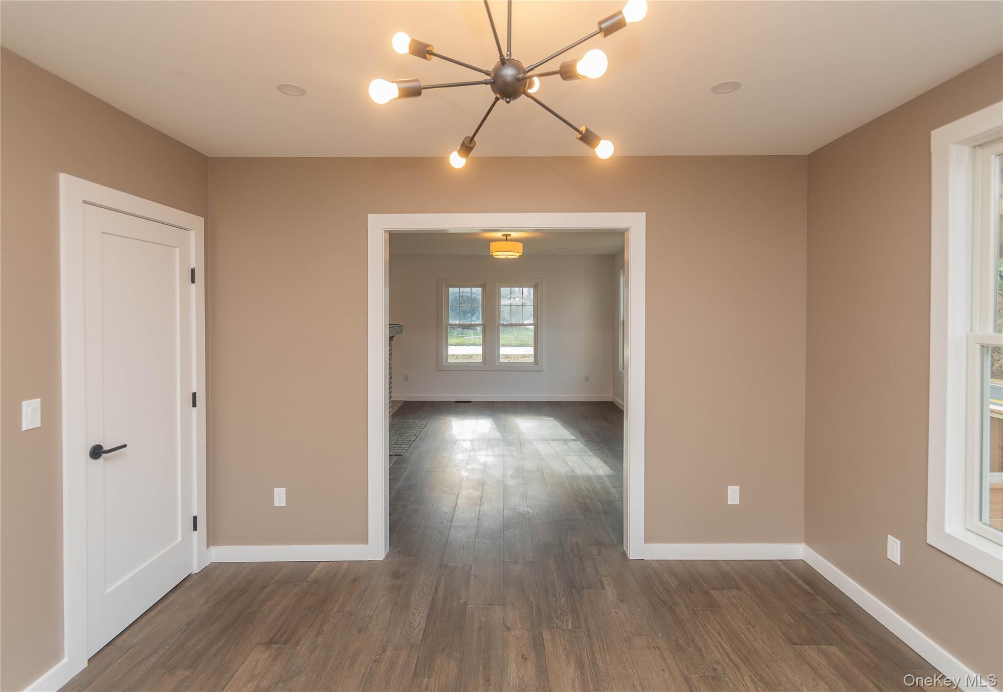 3 Anna Street Kerhonkson, NY 12446 - Photo 17 of 40 Spare room featuring a chandelier and dark wood floors