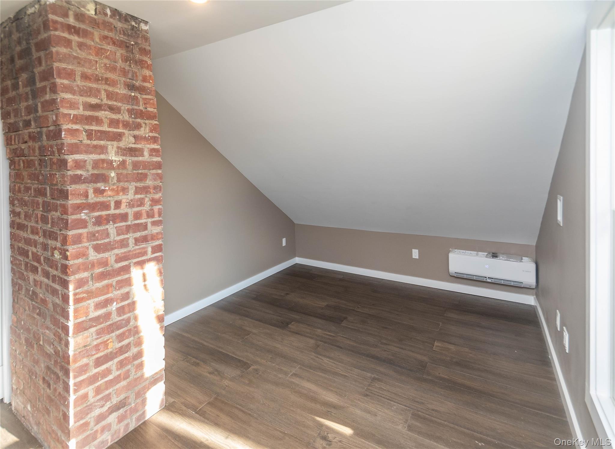 3 Anna Street Kerhonkson, NY 12446 - Photo 25 of 40 Third bedroom featuring lofted ceiling and dark wood flooring
