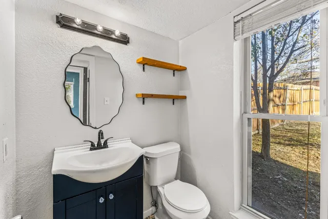 view of a room that has a door and a window