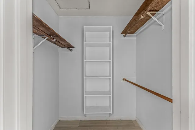 a bathroom with a toilet and a tub