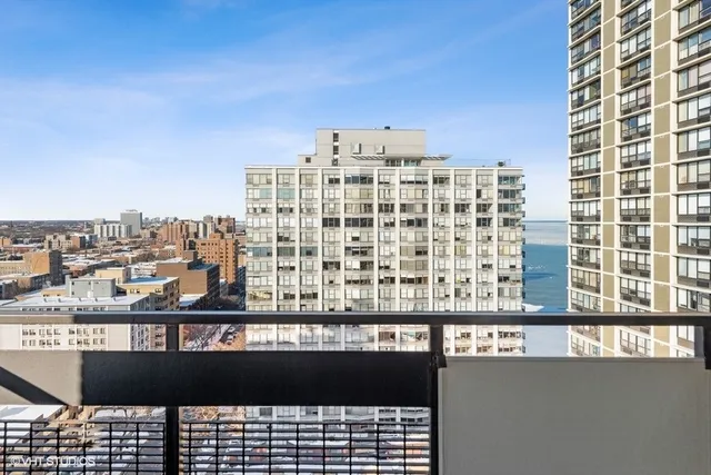 a view of a balcony with a city view
