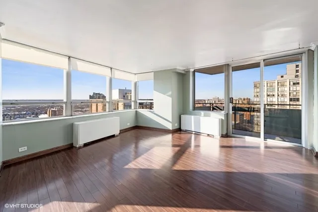 a kitchen with stainless steel appliances wooden floors and wooden cabinets