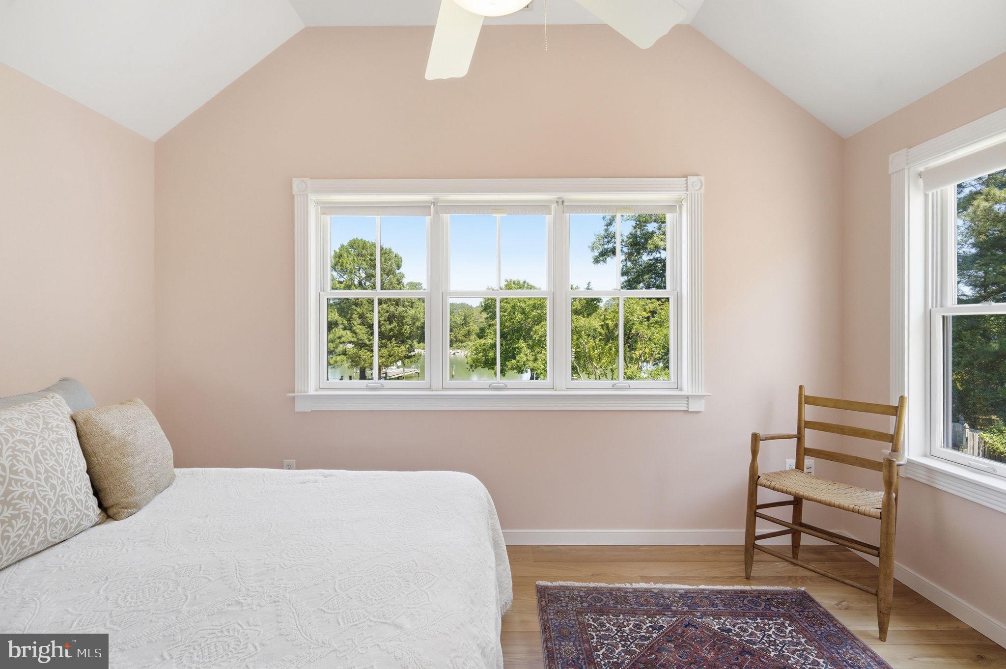 26226 Langs Landing Road Oxford, MD 21654 - Photo 30 of 48 a bedroom with a bed and a window