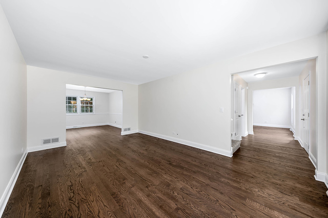 2010 Bilter Road Aurora, IL 60502 - Photo 14 of 47 an empty room with wooden floor and windows