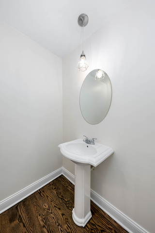 2010 Bilter Road Aurora, IL 60502 - Photo 17 of 47 a bathroom with a sink and mirror