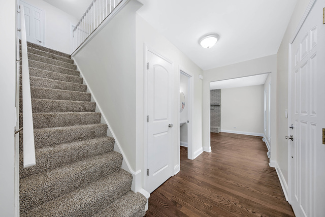 2010 Bilter Road Aurora, IL 60502 - Photo 18 of 47 a view of a hallway with wooden floor and entryway