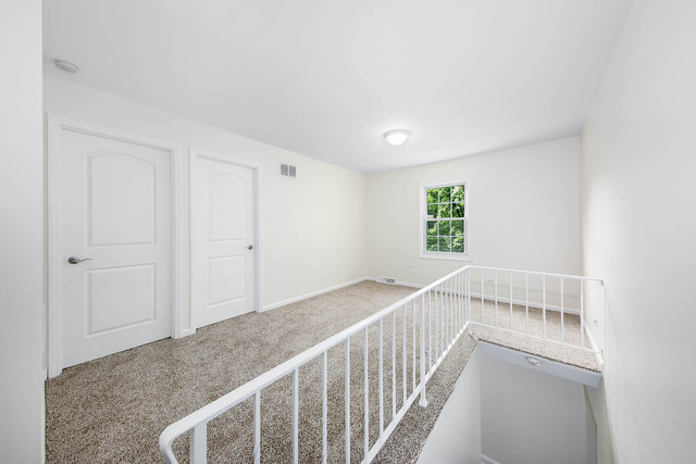 2010 Bilter Road Aurora, IL 60502 - Photo 19 of 47 a view of a hallway with a window