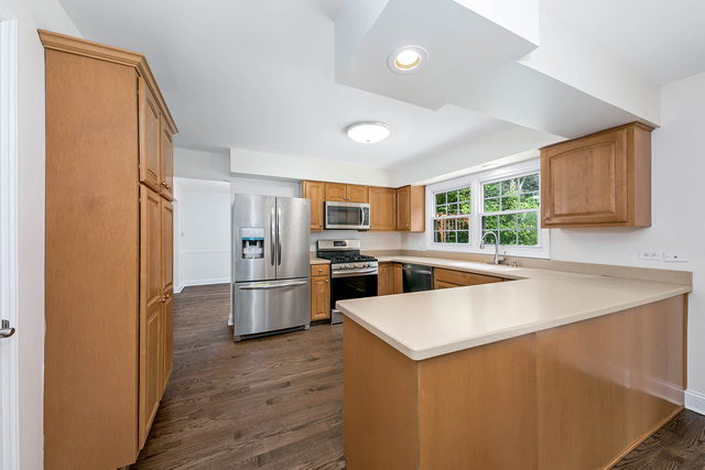 2010 Bilter Road Aurora, IL 60502 - Photo 8 of 47 a kitchen with stainless steel appliances a refrigerator and a stove top oven
