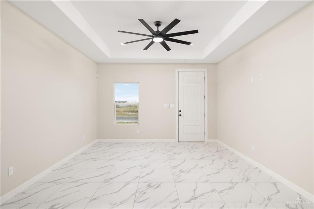 348 Coro Street Donna, TX 78537 - Photo 2 of 17 a view of room with window and ceiling fan
