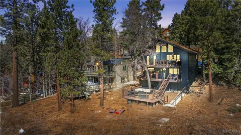 a view of a house with a tree