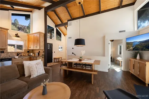 a kitchen with stainless steel appliances granite countertop a refrigerator stove and sink