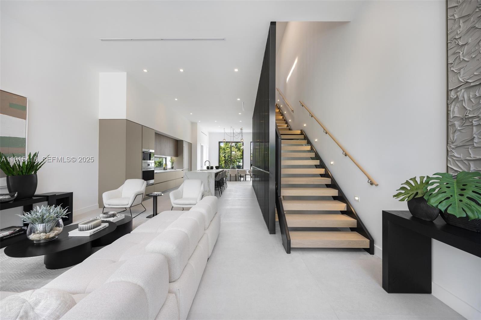 86 Southwest 28th Road, Unit 7 Miami, FL 33129 - Photo 12 of 33 a living room with furniture and stairs
