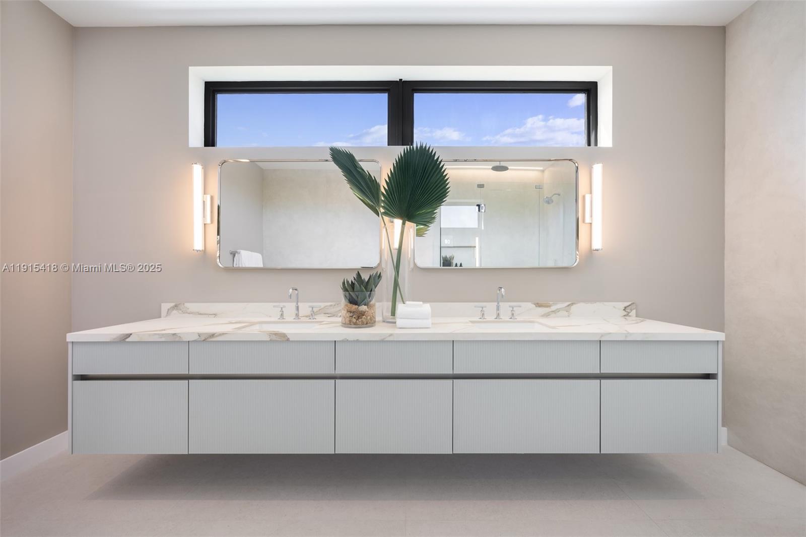 86 Southwest 28th Road, Unit 7 Miami, FL 33129 - Photo 22 of 33 a bathroom with a sink and a mirror