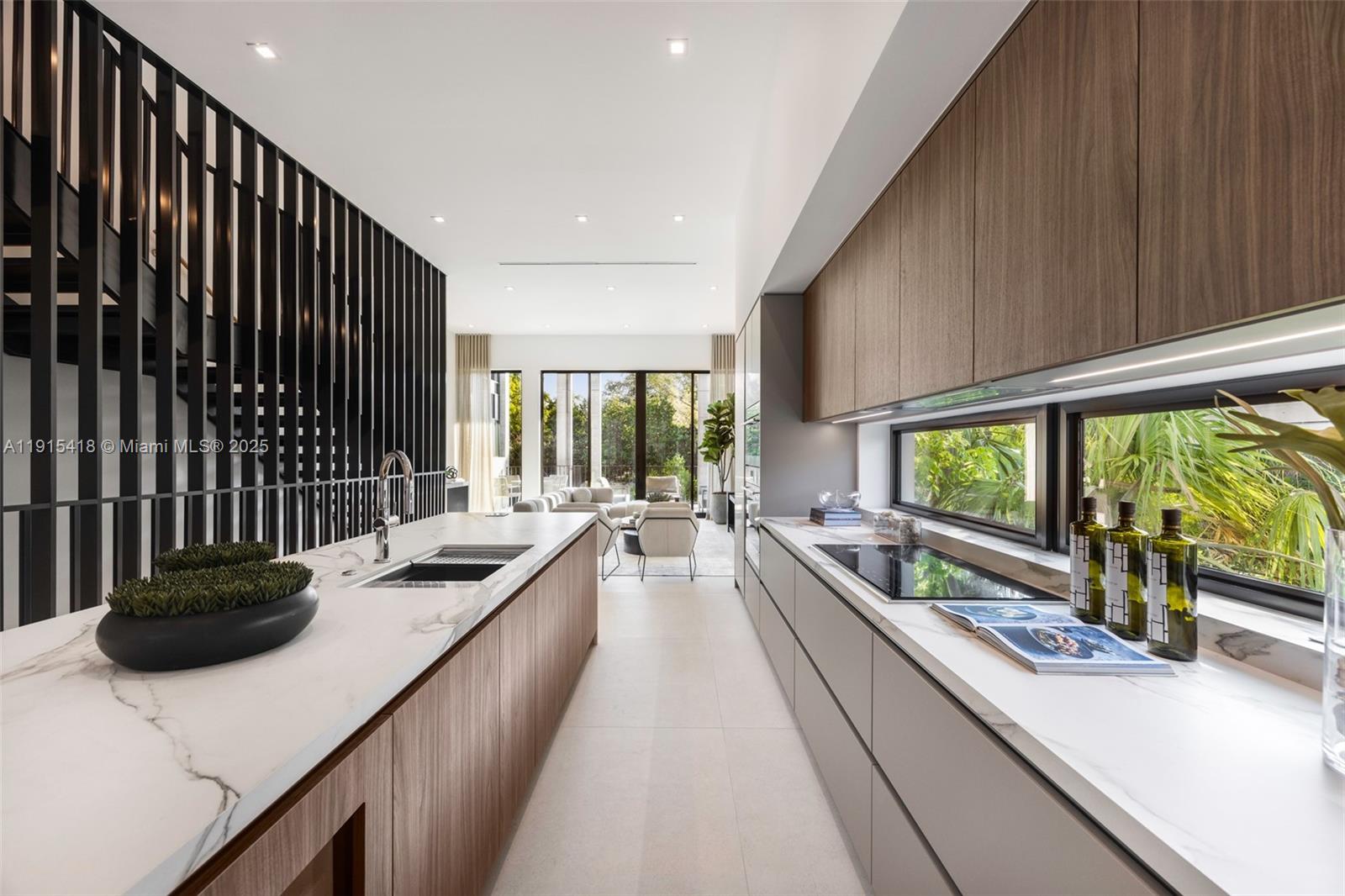 86 Southwest 28th Road, Unit 7 Miami, FL 33129 - Photo 8 of 33 a kitchen with lots of counter top space and living space