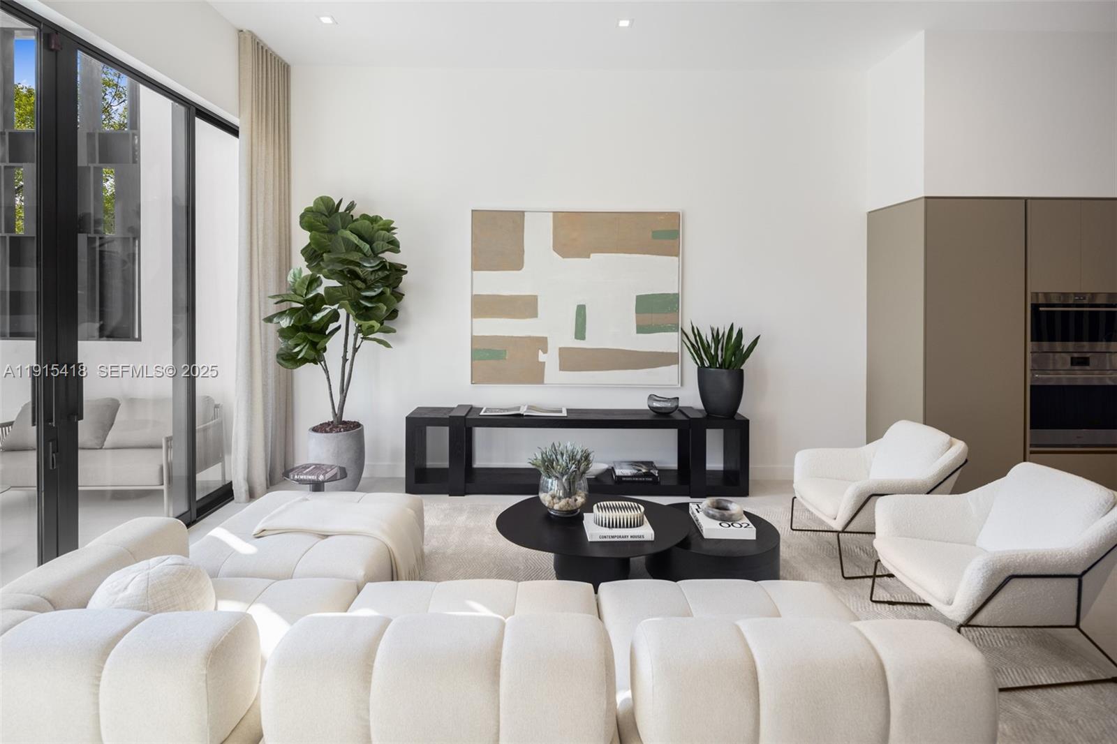 86 Southwest 28th Road, Unit 7 Miami, FL 33129 - Photo 10 of 33 a bedroom with furniture and a large window