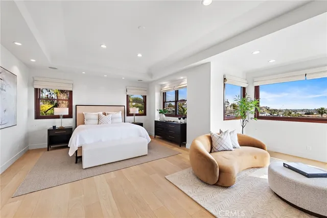 a bedroom with a large bed and a couch