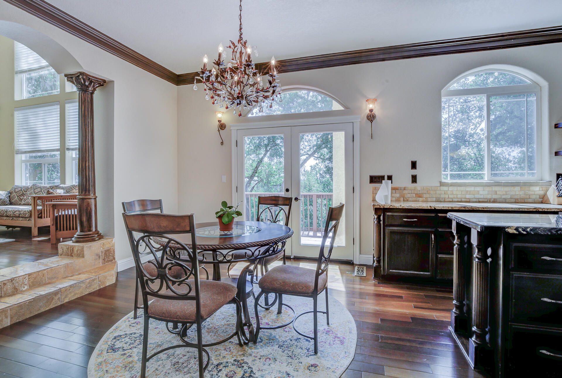 5146 Surrey Drive Redding, CA 96002 - Photo 11 of 57 a dining room with furniture a chandelier and wooden floor