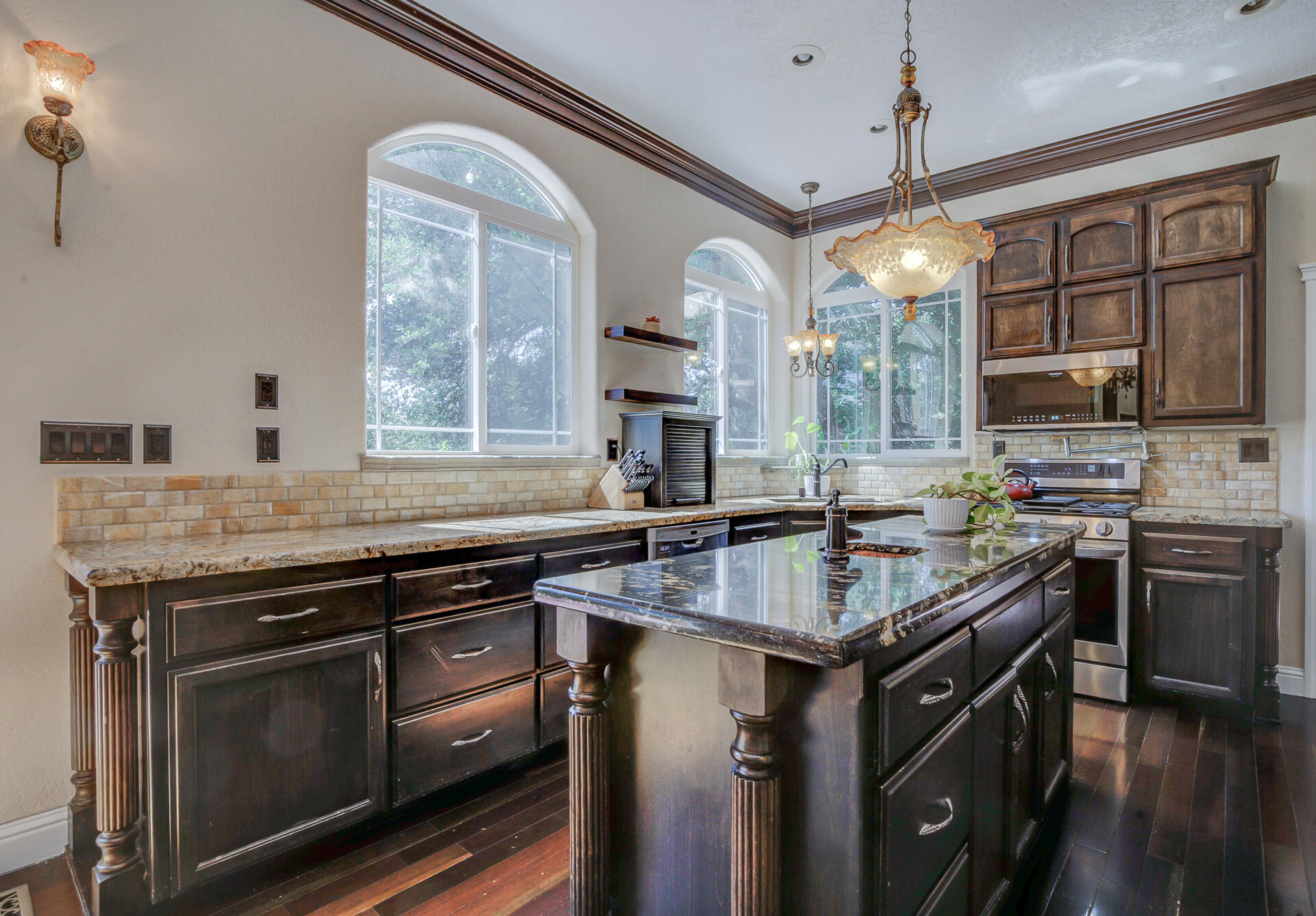 5146 Surrey Drive Redding, CA 96002 - Photo 16 of 57 a kitchen with stainless steel appliances granite countertop a stove and a sink