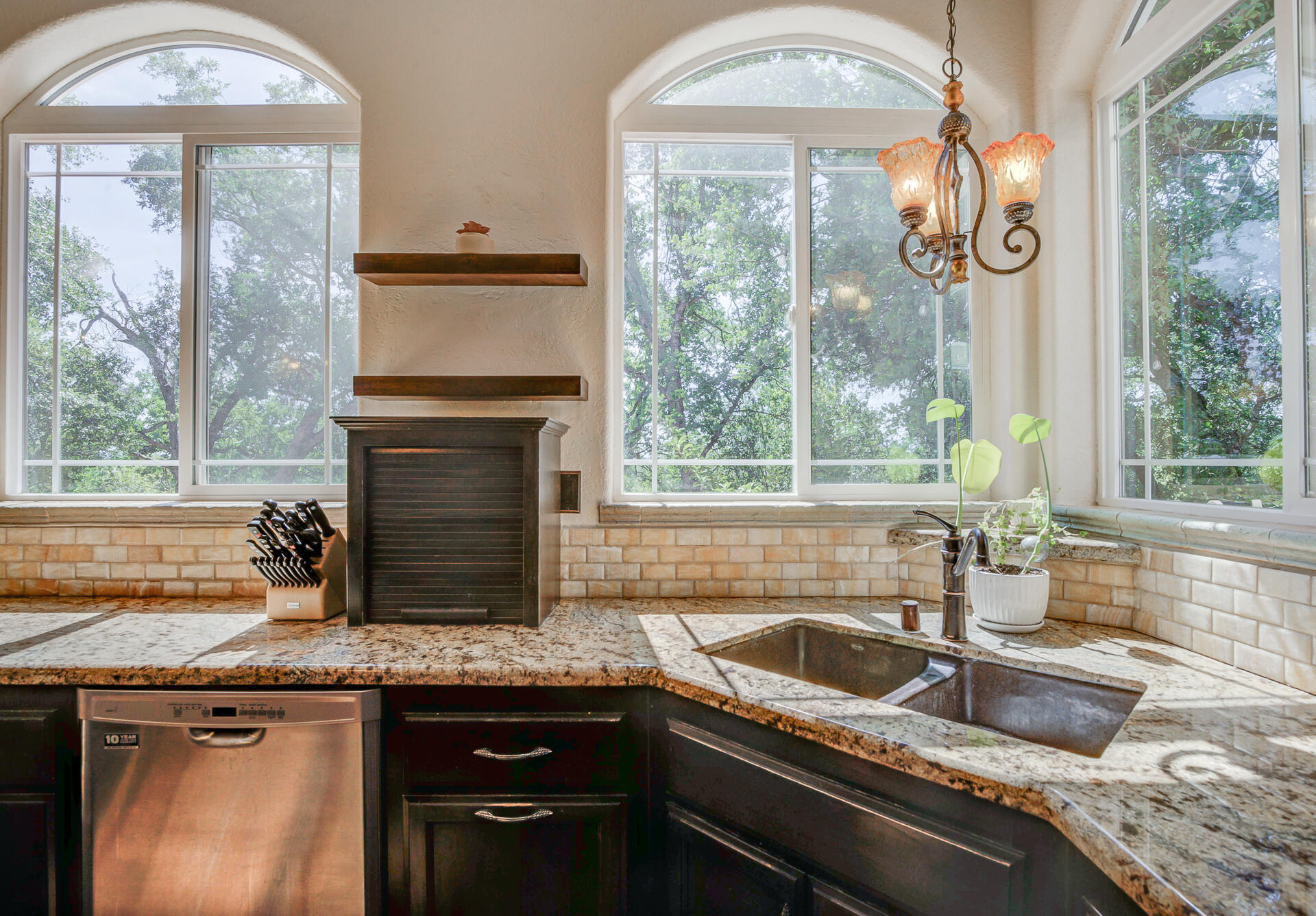 5146 Surrey Drive Redding, CA 96002 - Photo 20 of 57 a kitchen with granite countertop a sink and a window