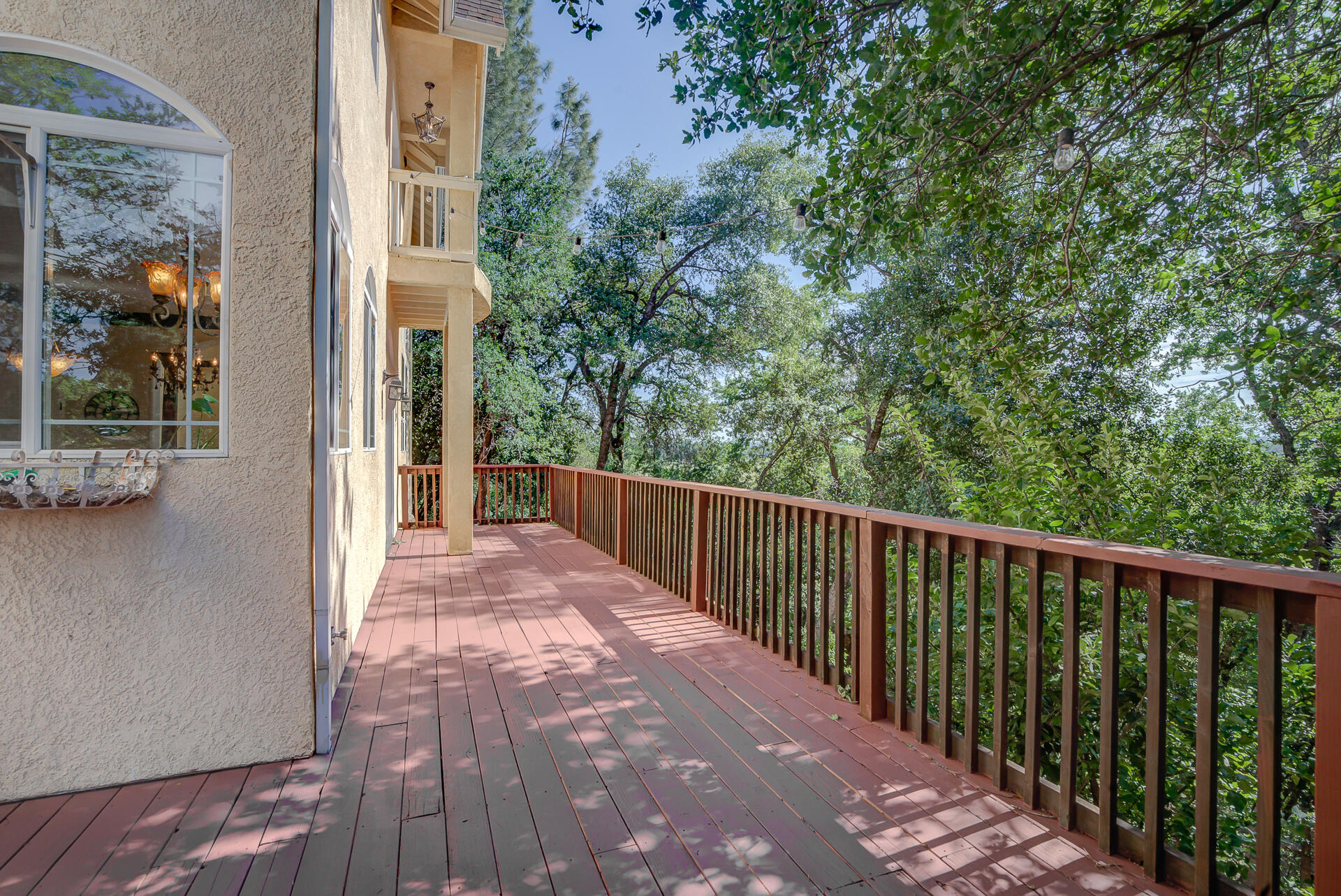 5146 Surrey Drive Redding, CA 96002 - Photo 45 of 57 a view of a balcony with a potted plant