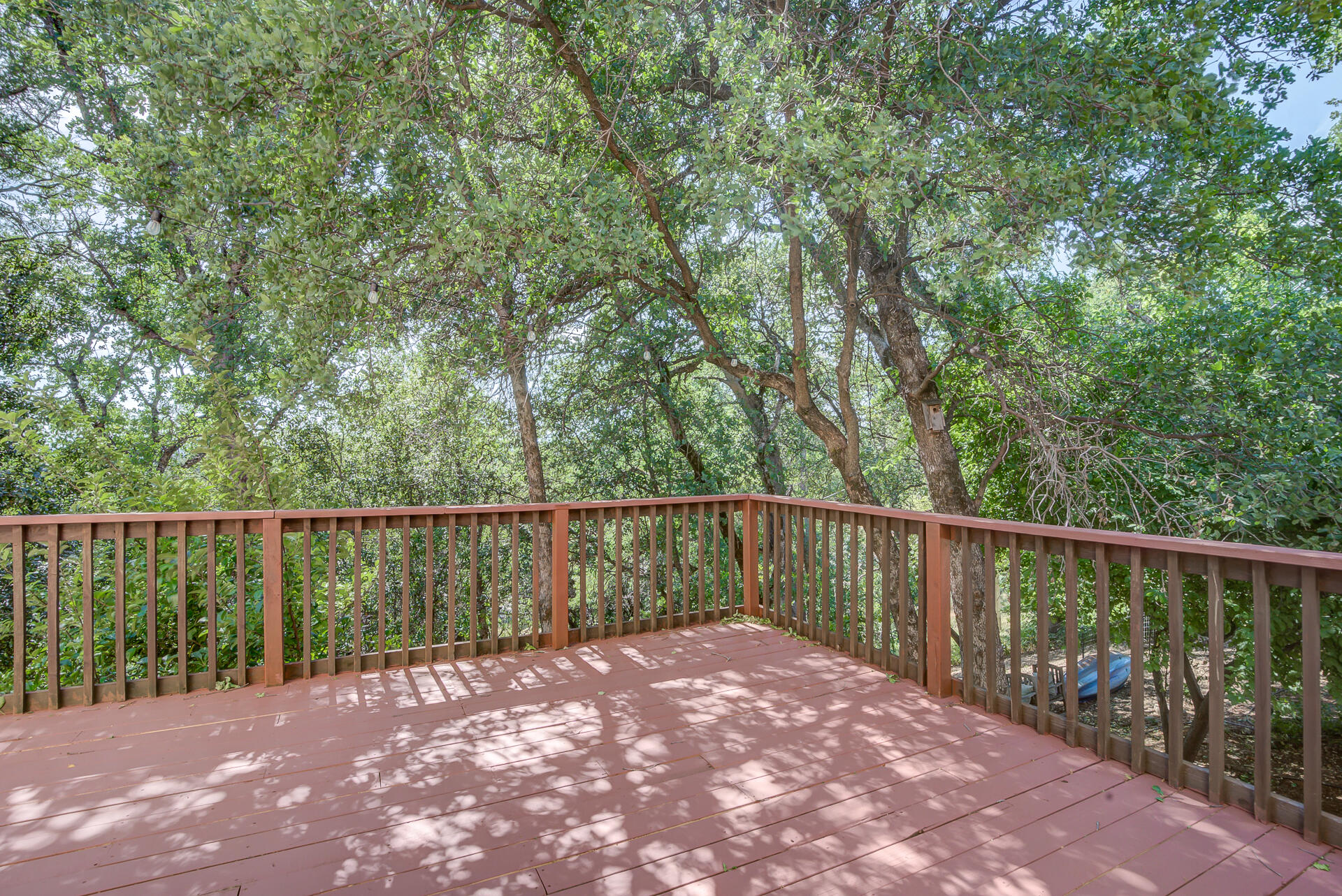 5146 Surrey Drive Redding, CA 96002 - Photo 50 of 57 a balcony with trees in the background
