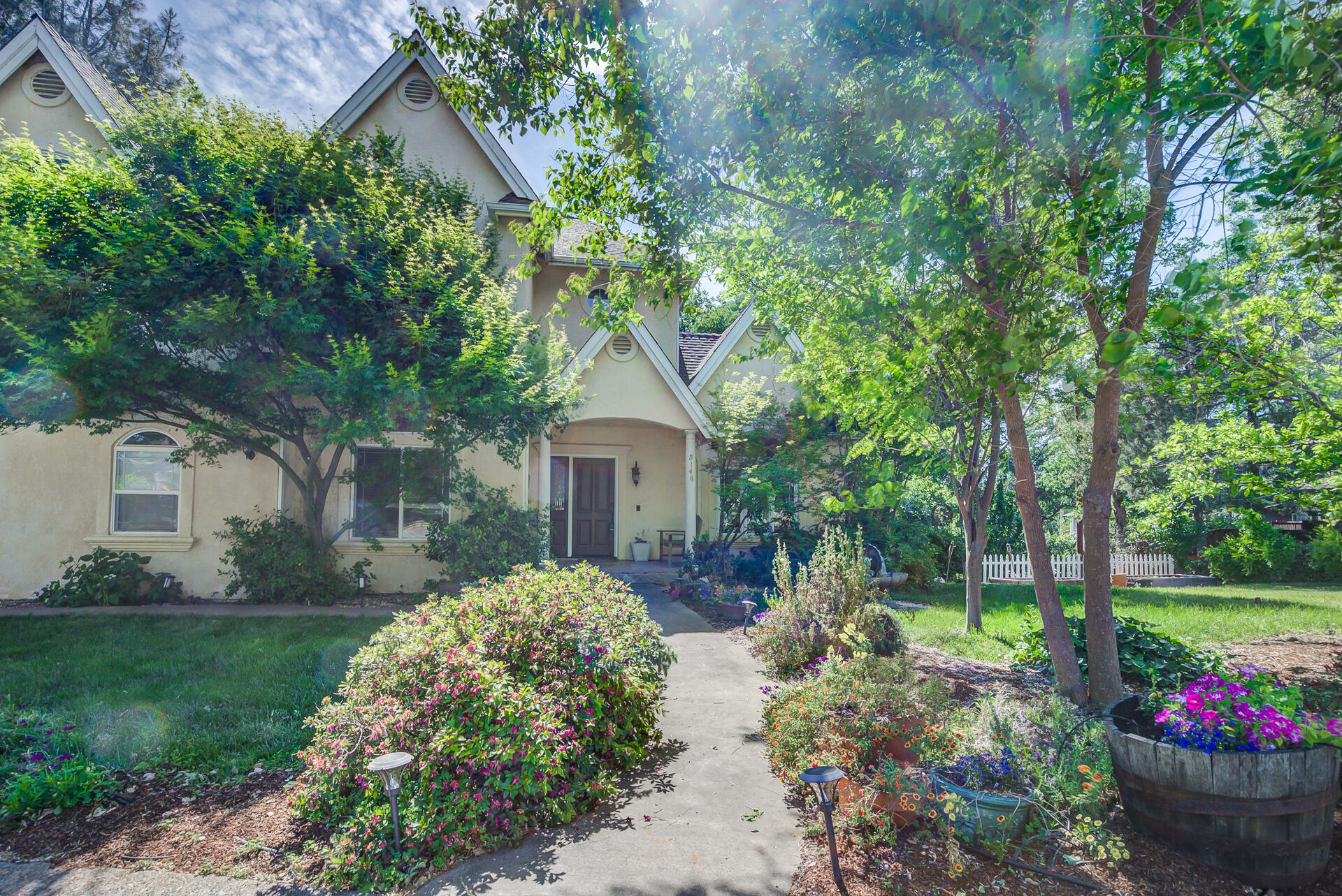 5146 Surrey Drive Redding, CA 96002 - Photo 53 of 57 a front view of a house with garden
