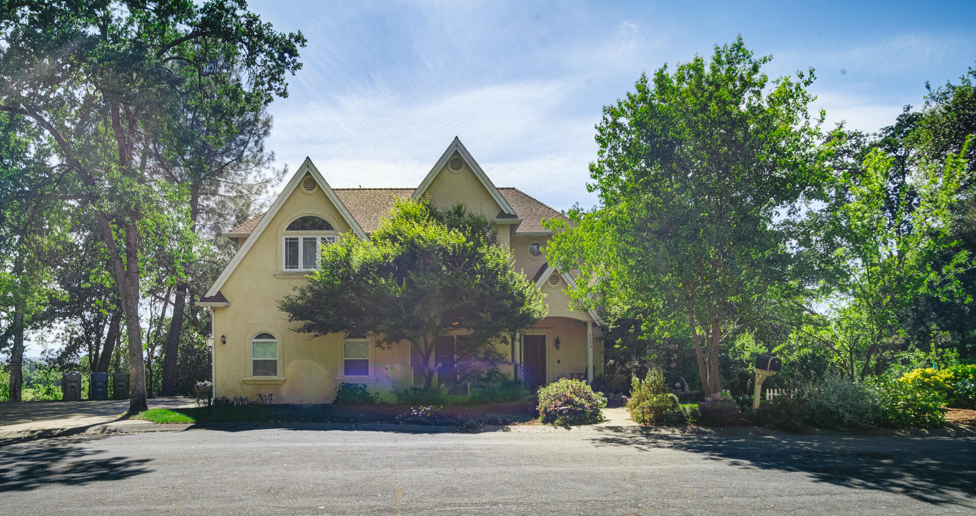 5146 Surrey Drive Redding, CA 96002 - Photo 55 of 57 a front view of a house with a yard and garage
