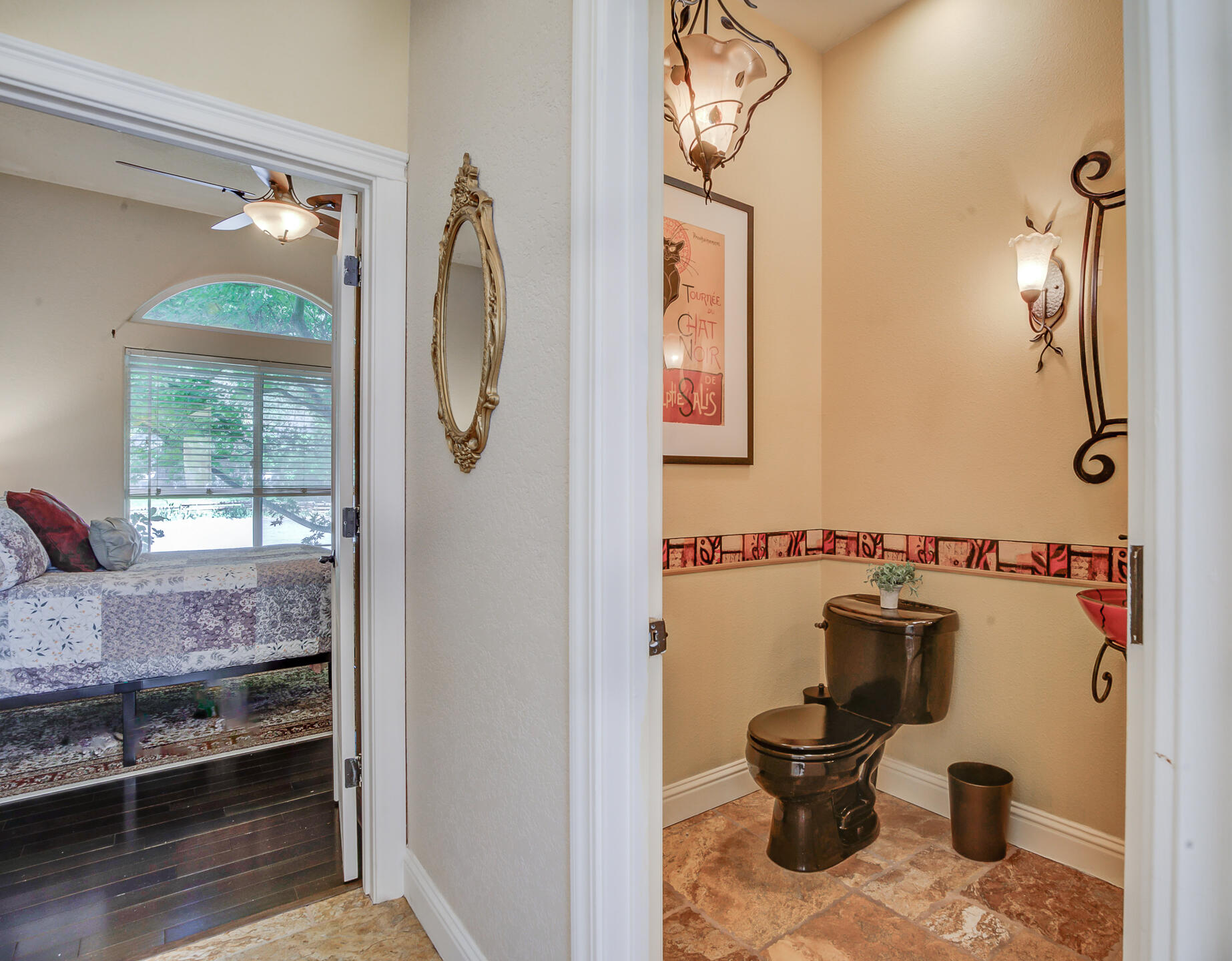 5146 Surrey Drive Redding, CA 96002 - Photo 10 of 57 a bathroom with a toilet sink and mirror