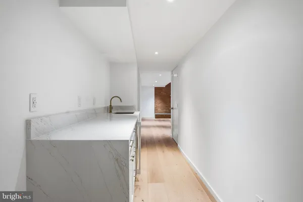 a hallway with a sink