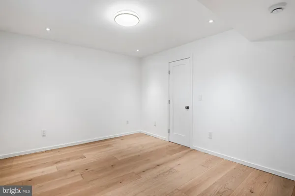 an empty room with wooden floor