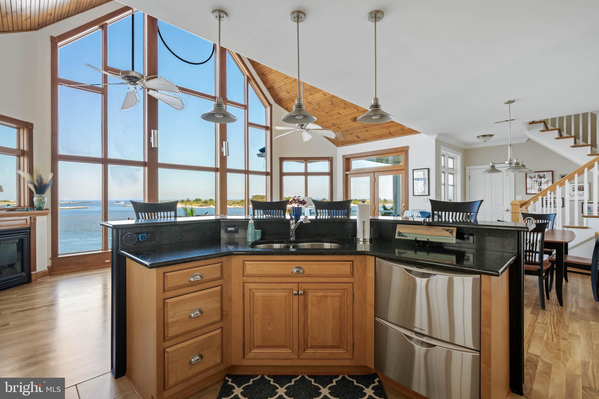 12959 Harbor Road Ocean City, MD 21842 - Photo 14 of 85 a kitchen with a sink and cabinets