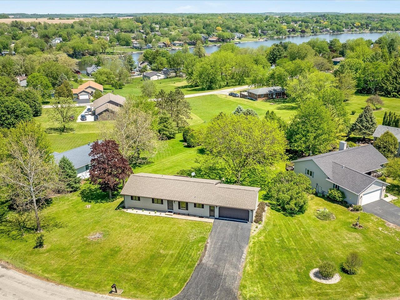 136 Lake Summerset Road Lake Summerset, IL 61019 - Photo 45 of 47 an aerial view of residential houses with outdoor space and pool