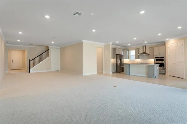 a view of kitchen with refrigerator and a window