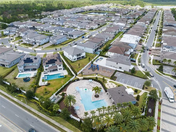 an aerial view of residential houses with outdoor space