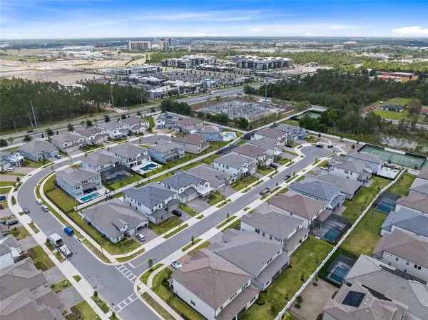 an aerial view of residential houses with swimming pool