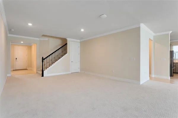 a view of an empty room with stairs