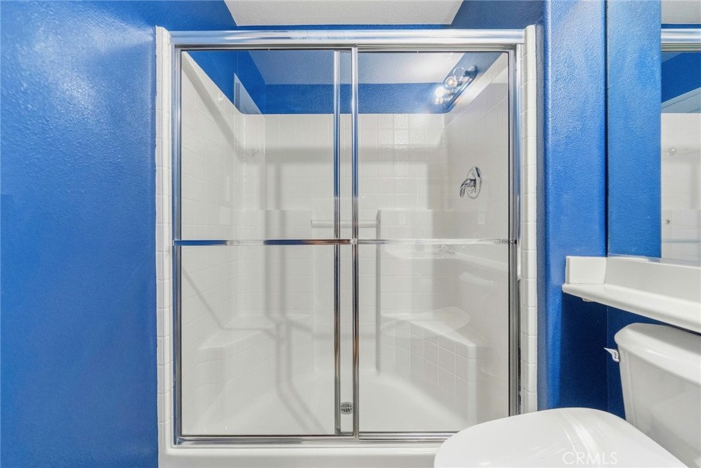 1663 Naranjo Court Redlands, CA 92374 - Photo 23 of 59 a bathroom with a toilet and a shower