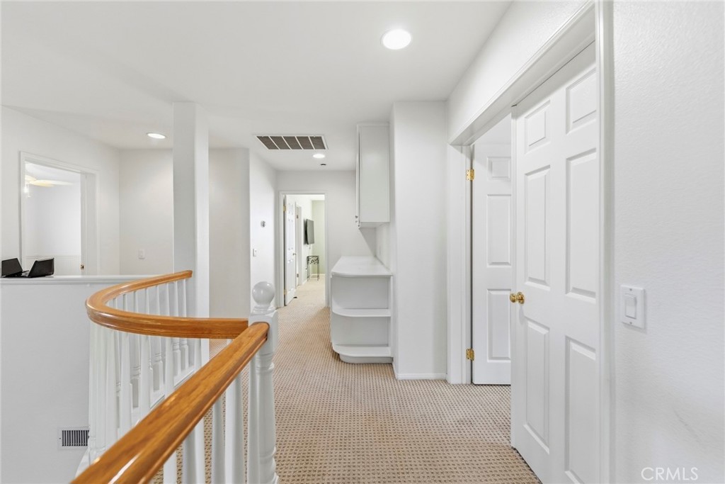 1663 Naranjo Court Redlands, CA 92374 - Photo 26 of 59 a view of a hallway with bathroom and a bathroom