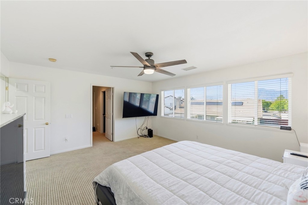 1663 Naranjo Court Redlands, CA 92374 - Photo 28 of 59 a bedroom with a bed and window