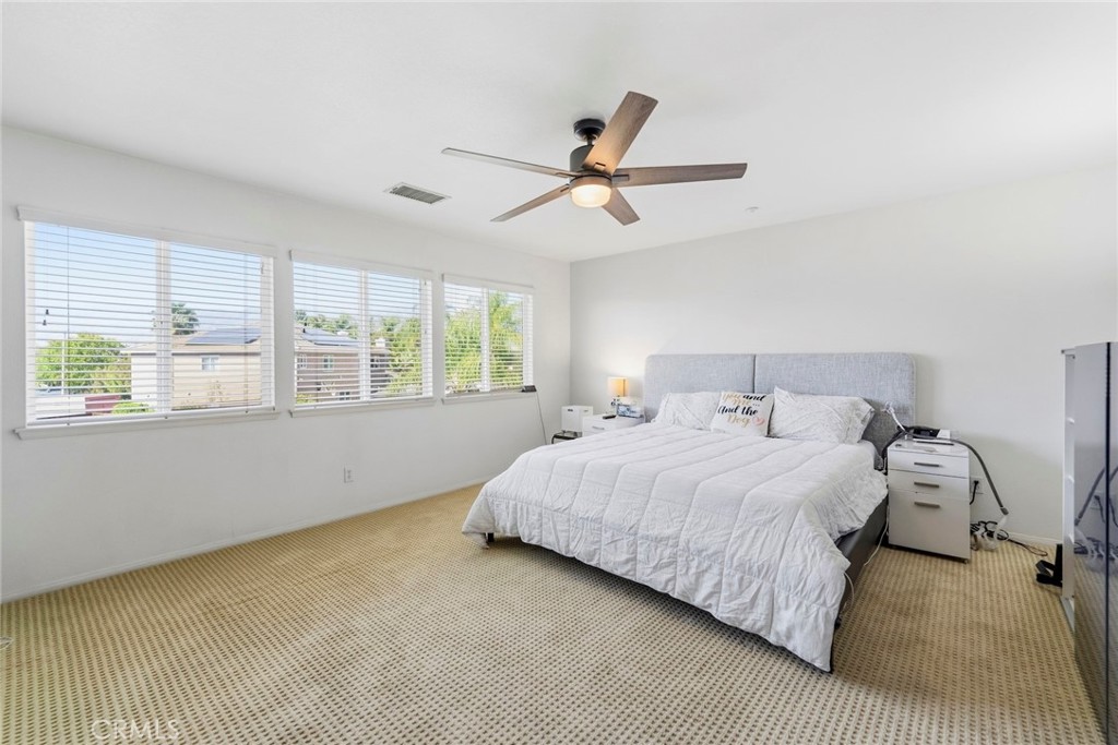 1663 Naranjo Court Redlands, CA 92374 - Photo 29 of 59 a bedroom with a bed and window