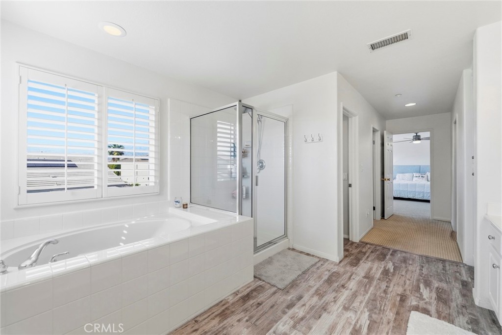 1663 Naranjo Court Redlands, CA 92374 - Photo 30 of 59 a spacious bathroom with a bathtub and a shower
