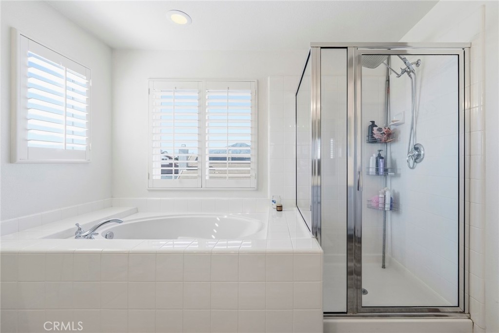1663 Naranjo Court Redlands, CA 92374 - Photo 34 of 59 a bathroom with a bathtub and a shower