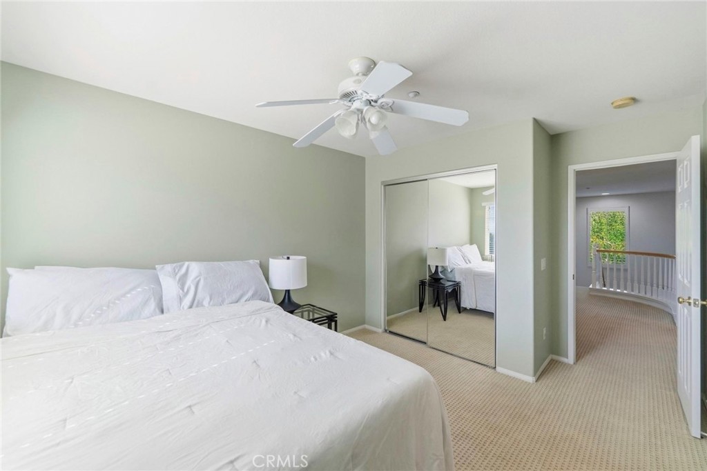 1663 Naranjo Court Redlands, CA 92374 - Photo 36 of 59 a bedroom with a bed and a chandelier