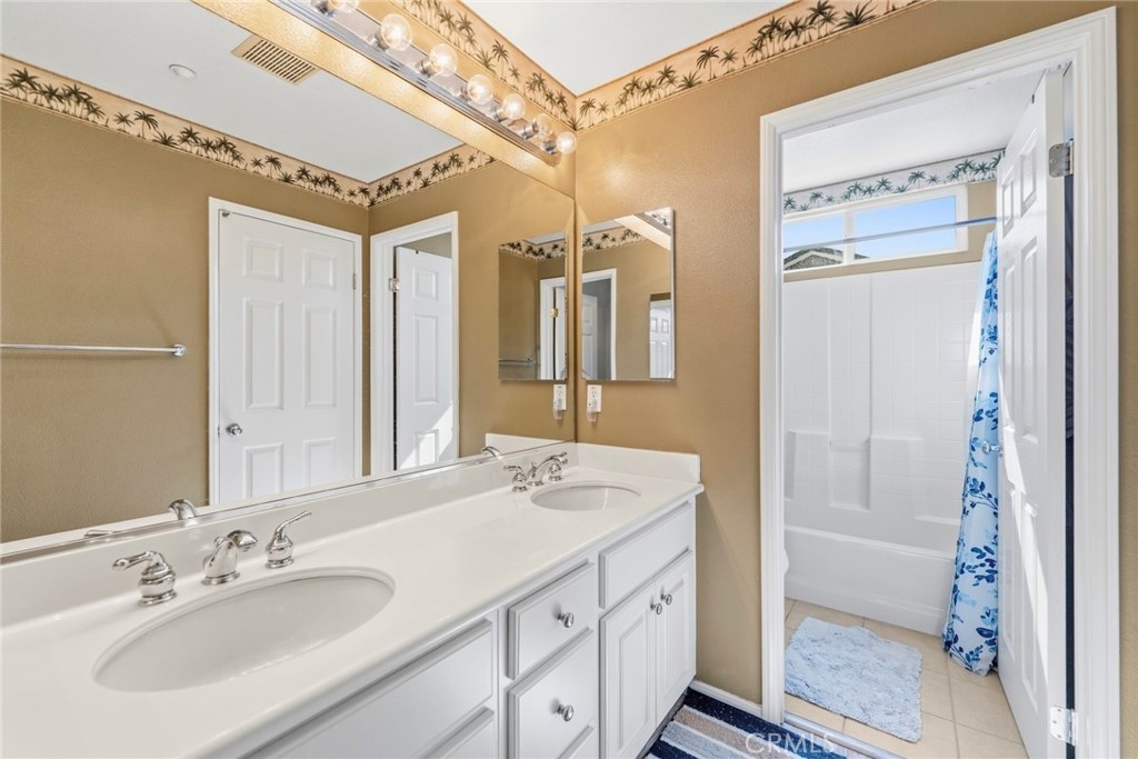 1663 Naranjo Court Redlands, CA 92374 - Photo 38 of 59 a bathroom with a sink and a mirror