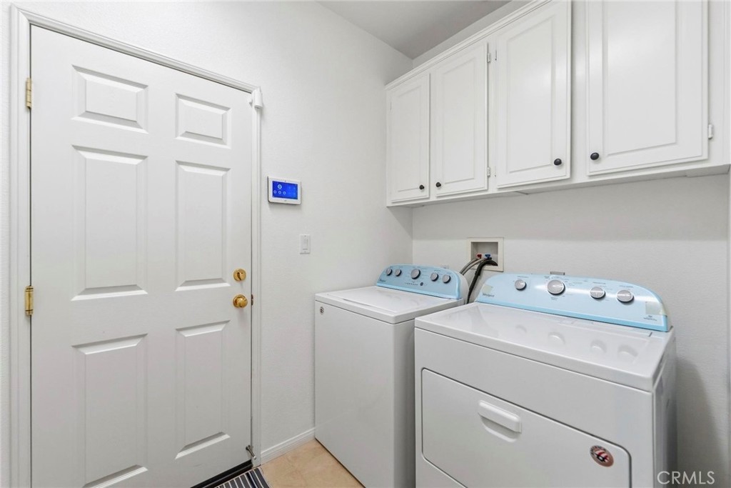 1663 Naranjo Court Redlands, CA 92374 - Photo 42 of 59 a view of storage and utility room with washer and dryer